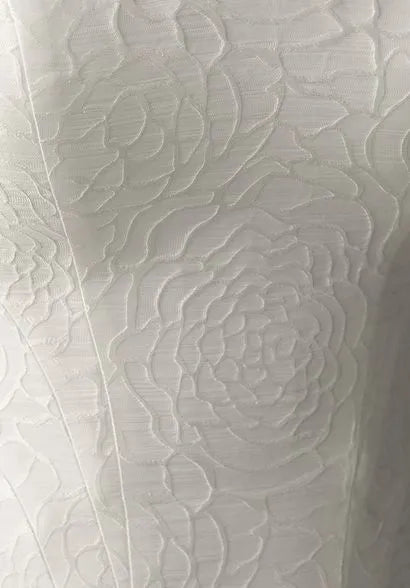 Close - up of jacquard satin with floral textures.