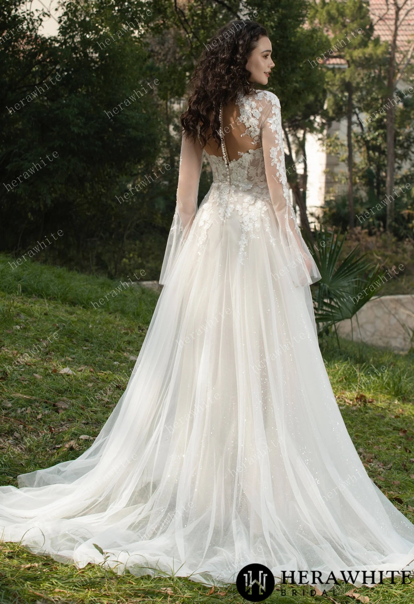 Back view of Bride wearing Ethel-Blossom long-sleeve lace wedding dress with tulle skirt.