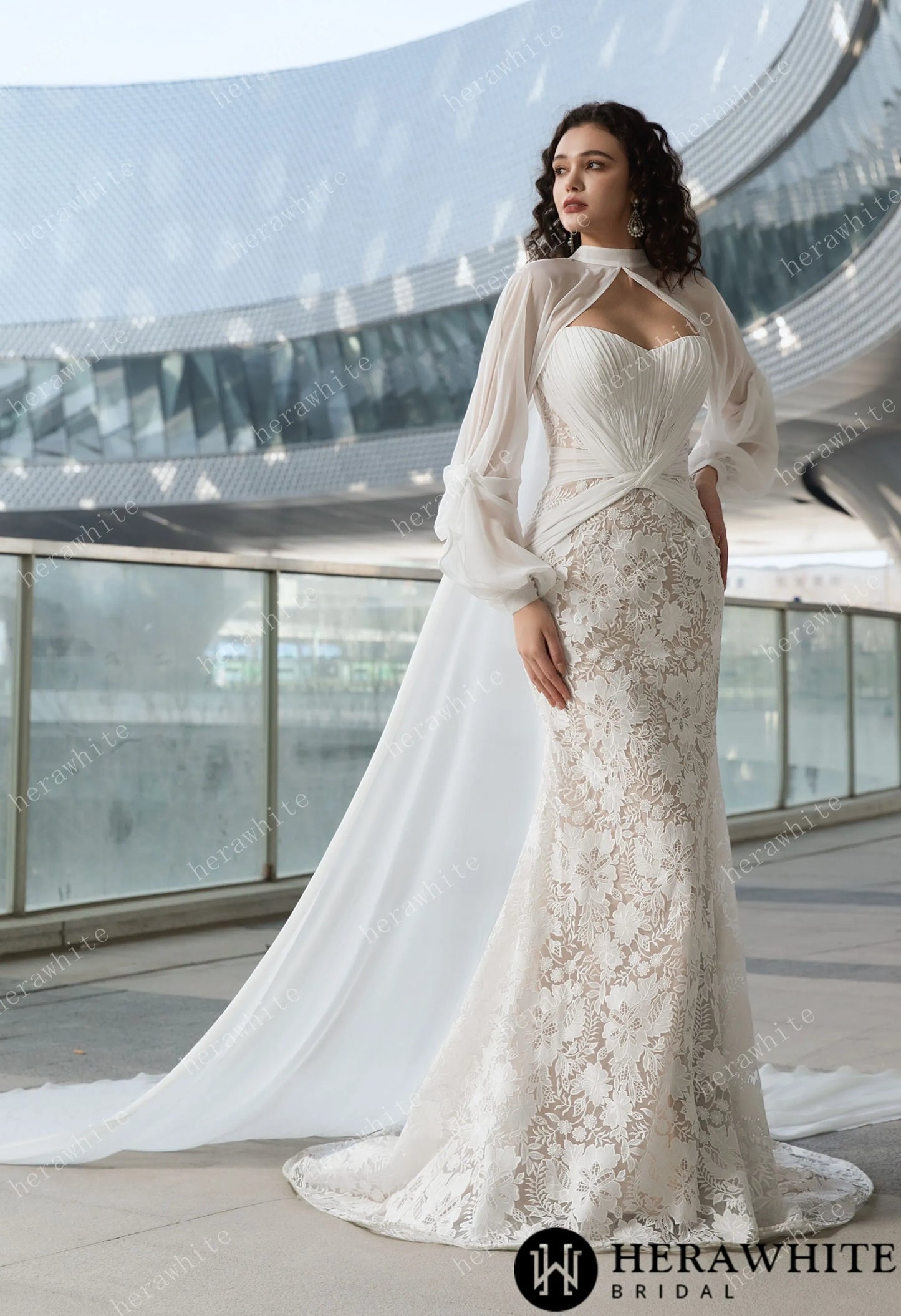 Bride wearing the Ruth- Pleated Mermaid Wedding Dress with Sheer Cape