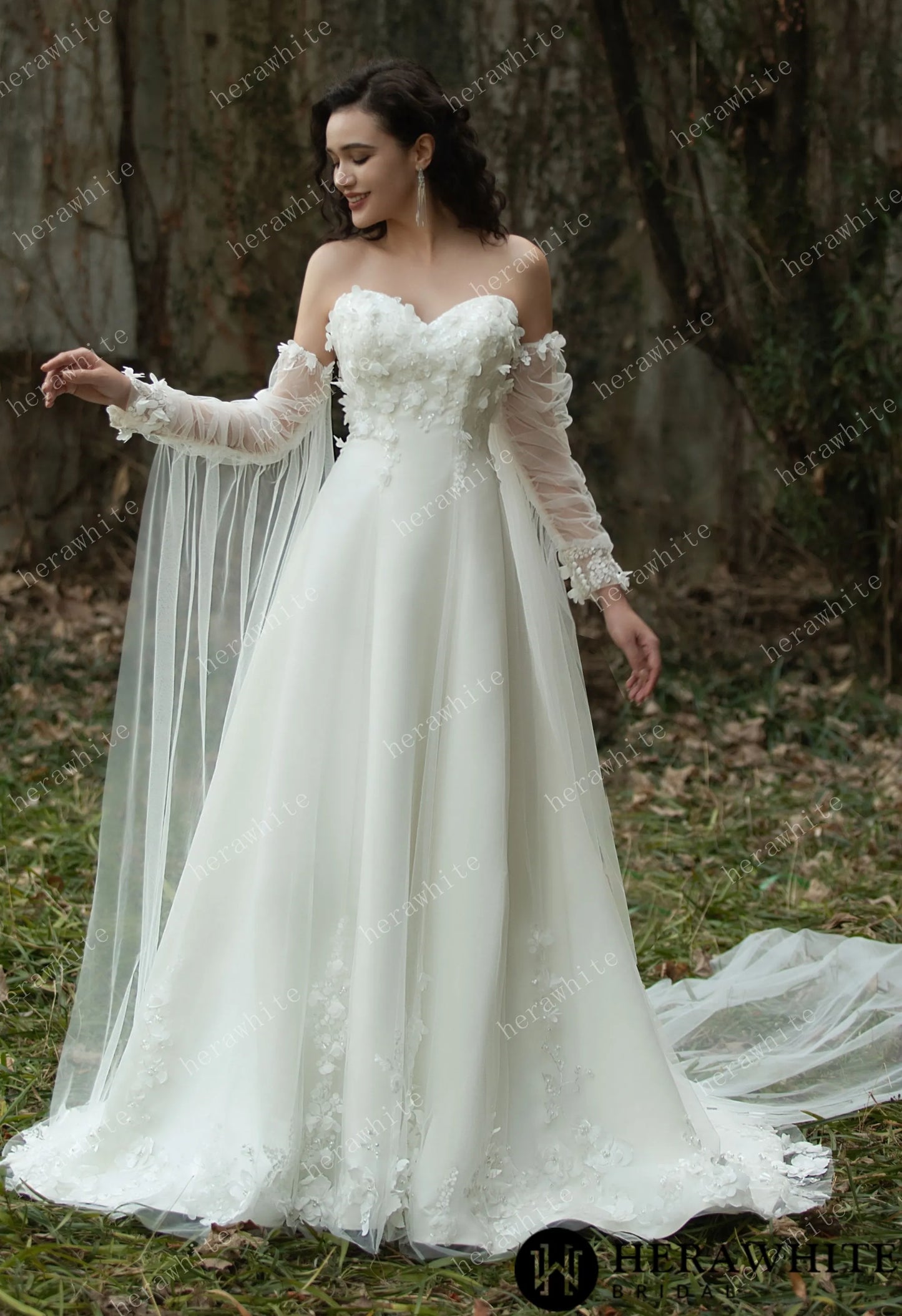 Bride wearing the Faith – Sweetheart Neckline Satin Bridal Gown with detachable sleeves & trailing Ribbons