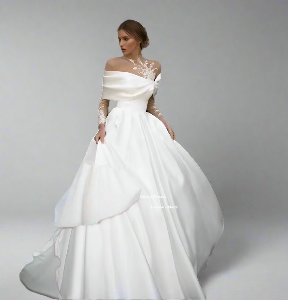 Elegant white wedding dress with floral appliqué and train