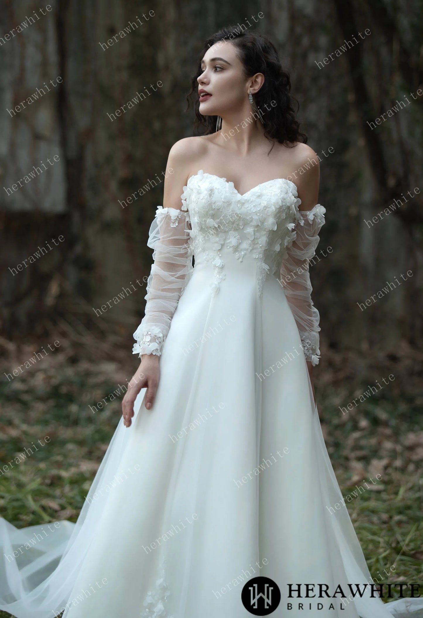 Bride wearing the Faith – Sweetheart Neckline Satin Bridal Gown with detachable sleeves & trailing Ribbons