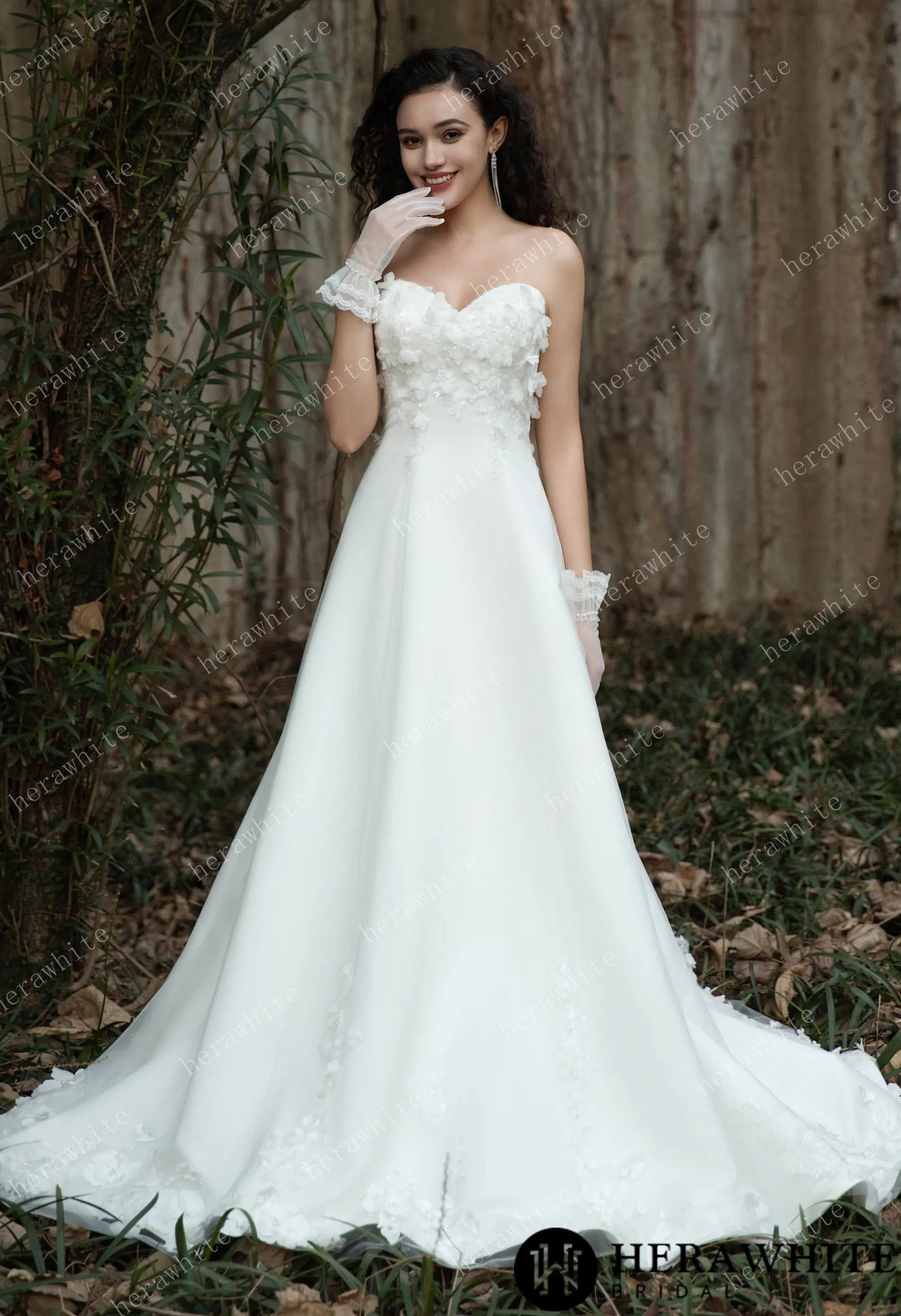 Bride wearing the Faith – Sweetheart Neckline Satin Bridal Gown with sheer gloves