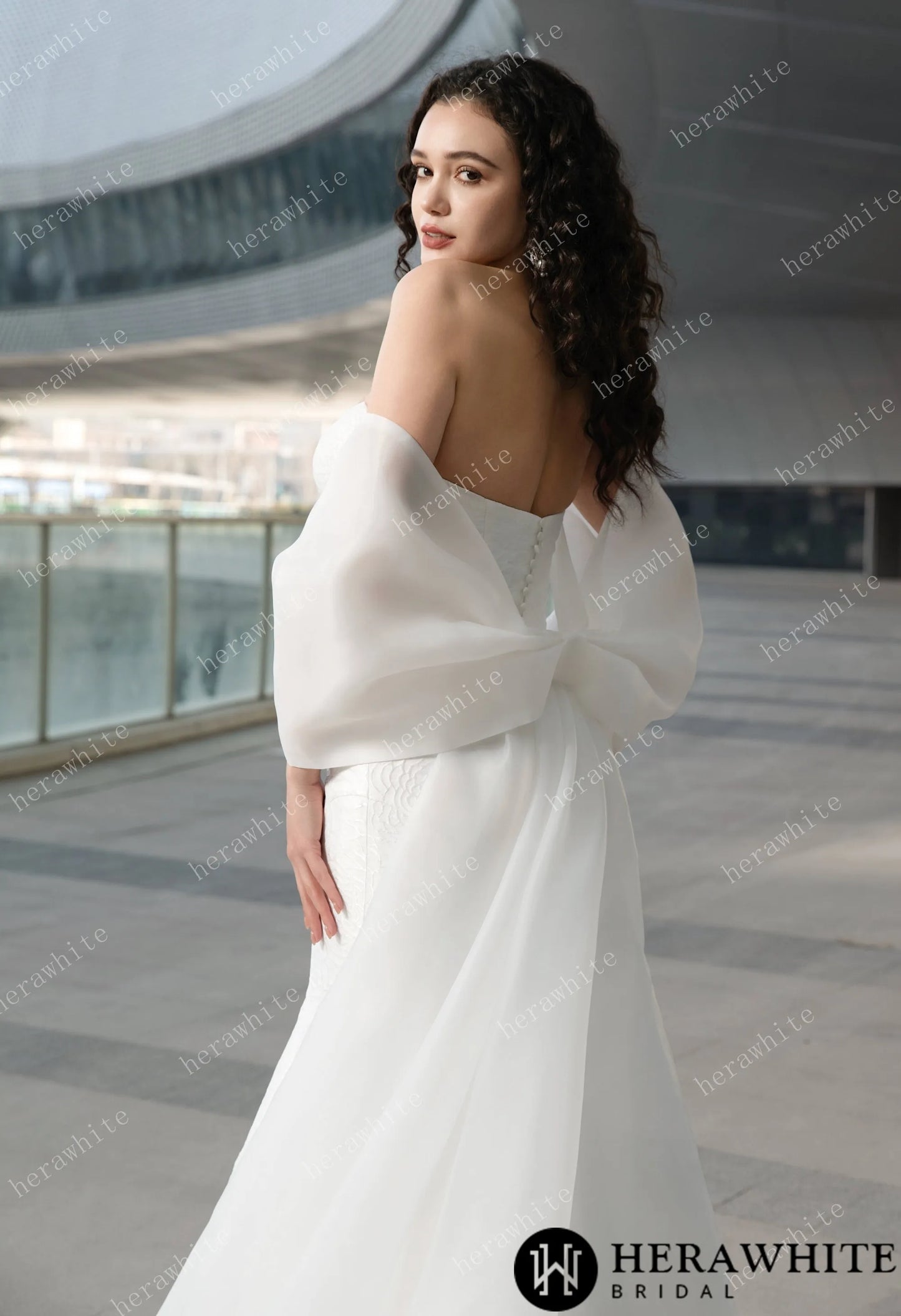 Back view of The Georgianna Jacquard satin mermaid wedding gown with detachable bow