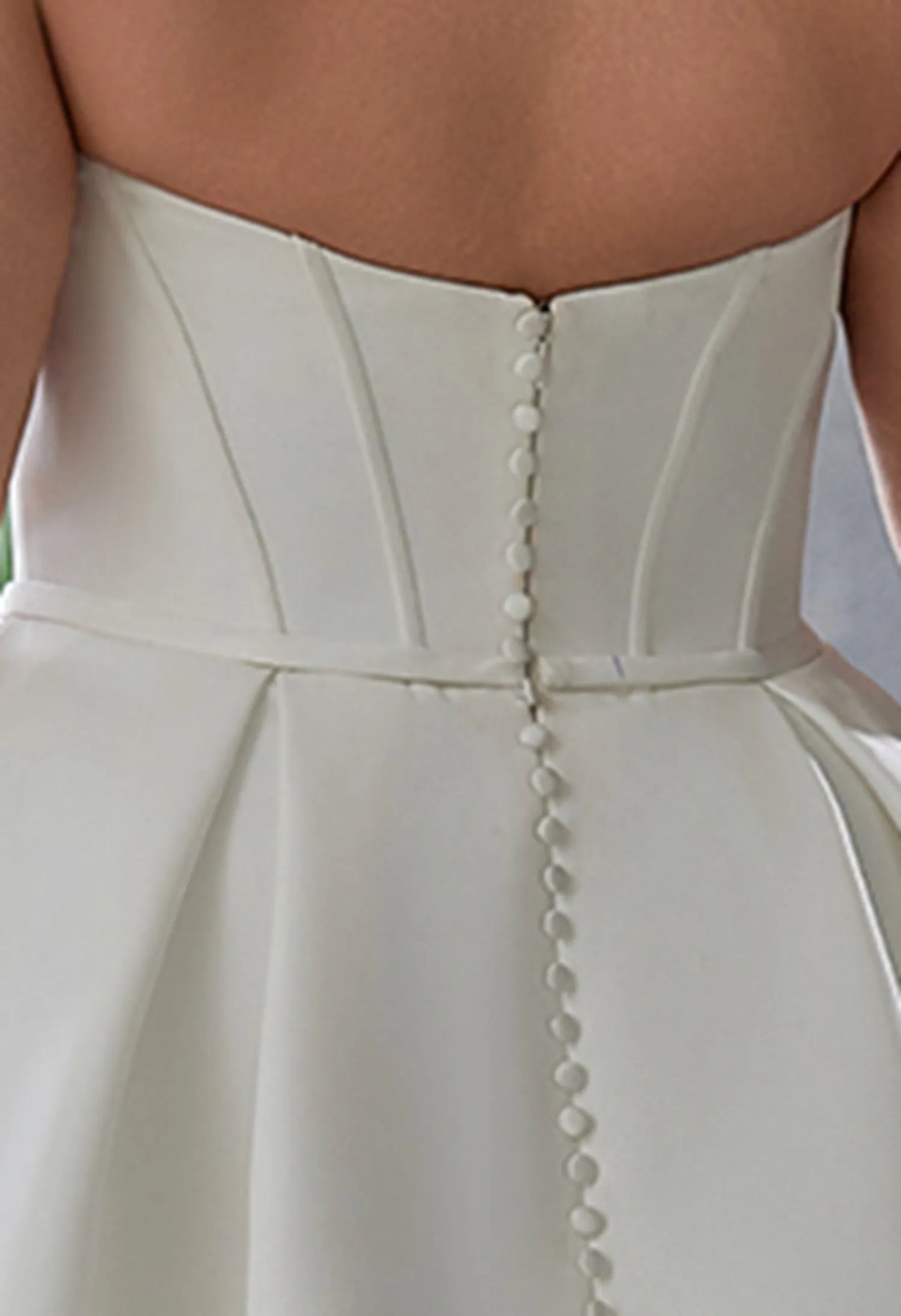 gown uses boning for structure, offering support and a flattering, sculpted silhouette.