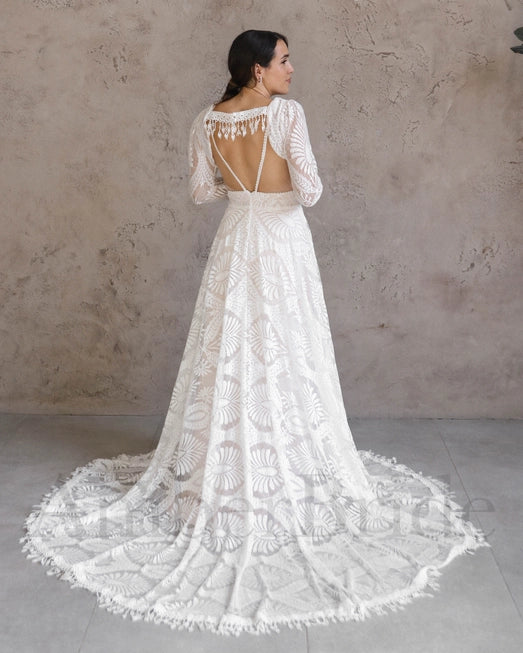 Model wearing stunning boho bridal gown with jacket