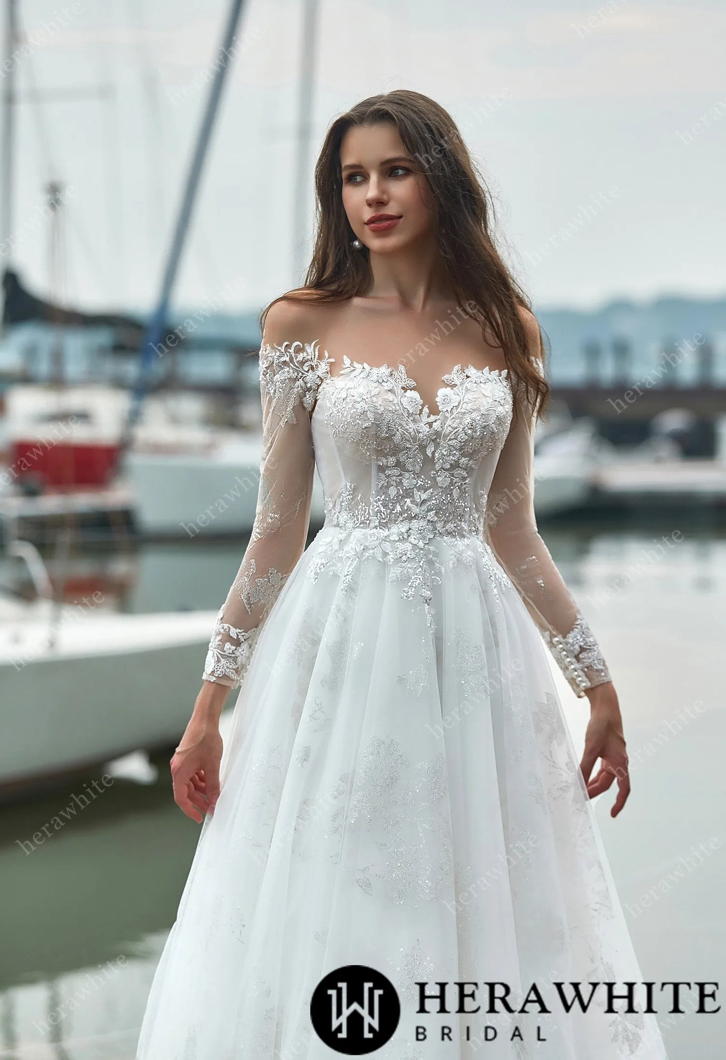 A-line wedding dress with lace bodice and sheer sleeves