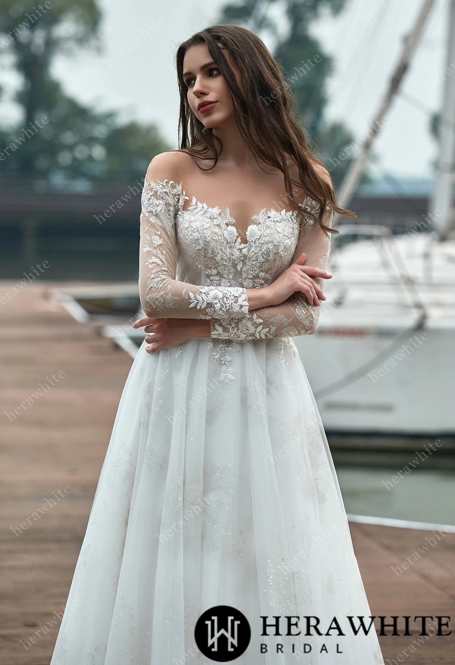 A-line wedding dress with lace and illusion bodice and sheer sleeves