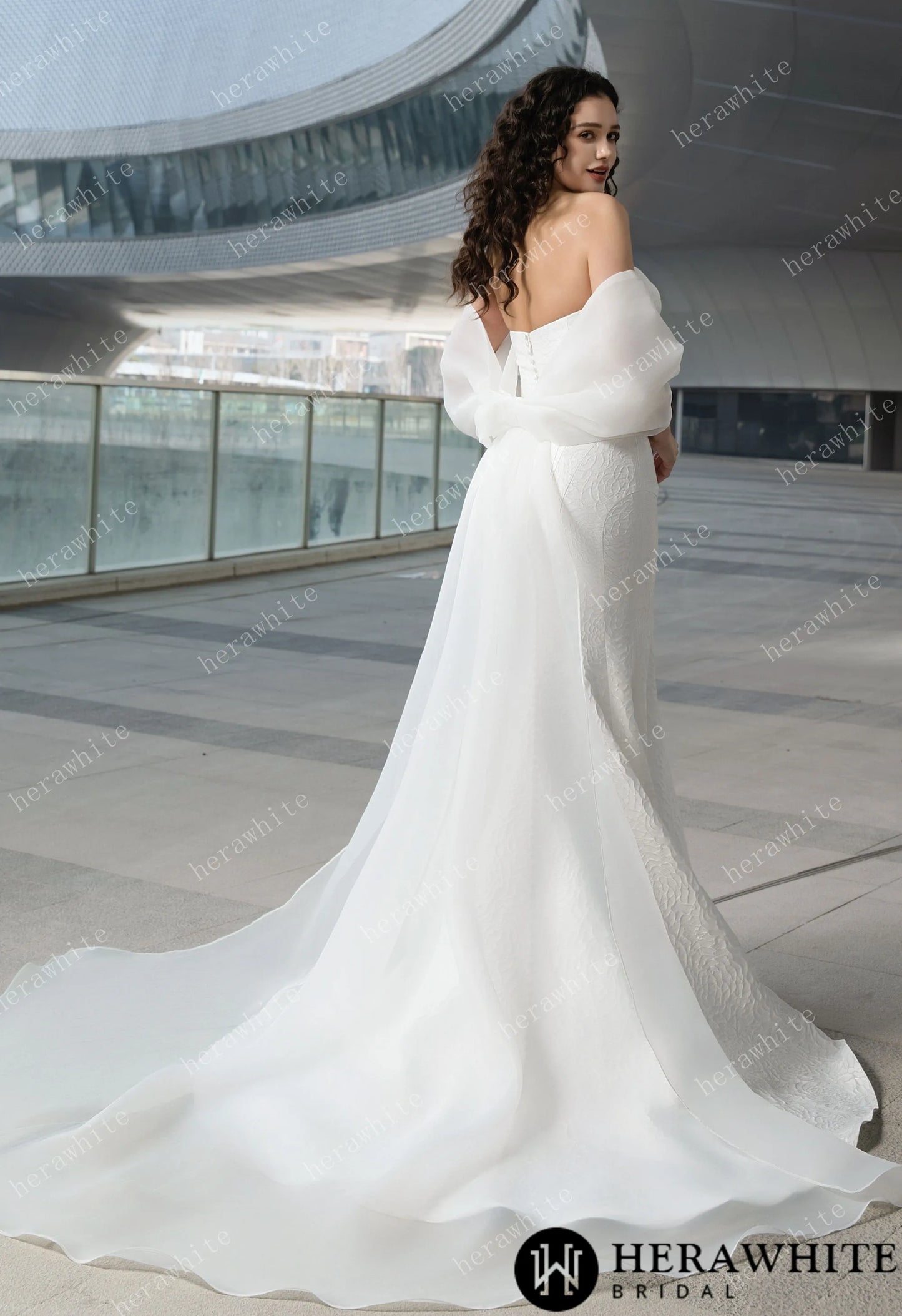 Back view of The Georgianna Jacquard satin mermaid wedding gown with detachable bow