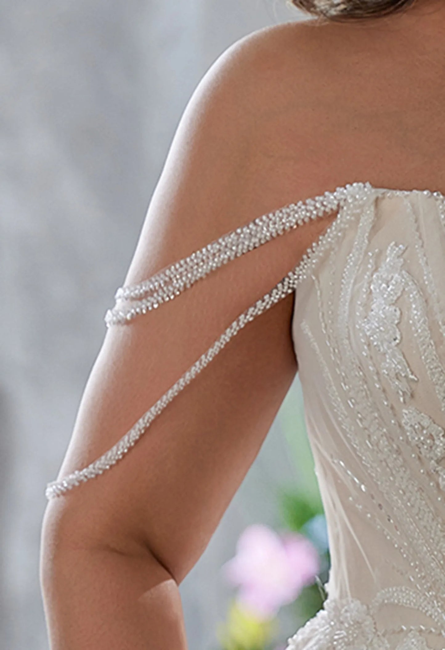Gown has beaded, off - shoulder, draped sleeve straps, delicate and chic.