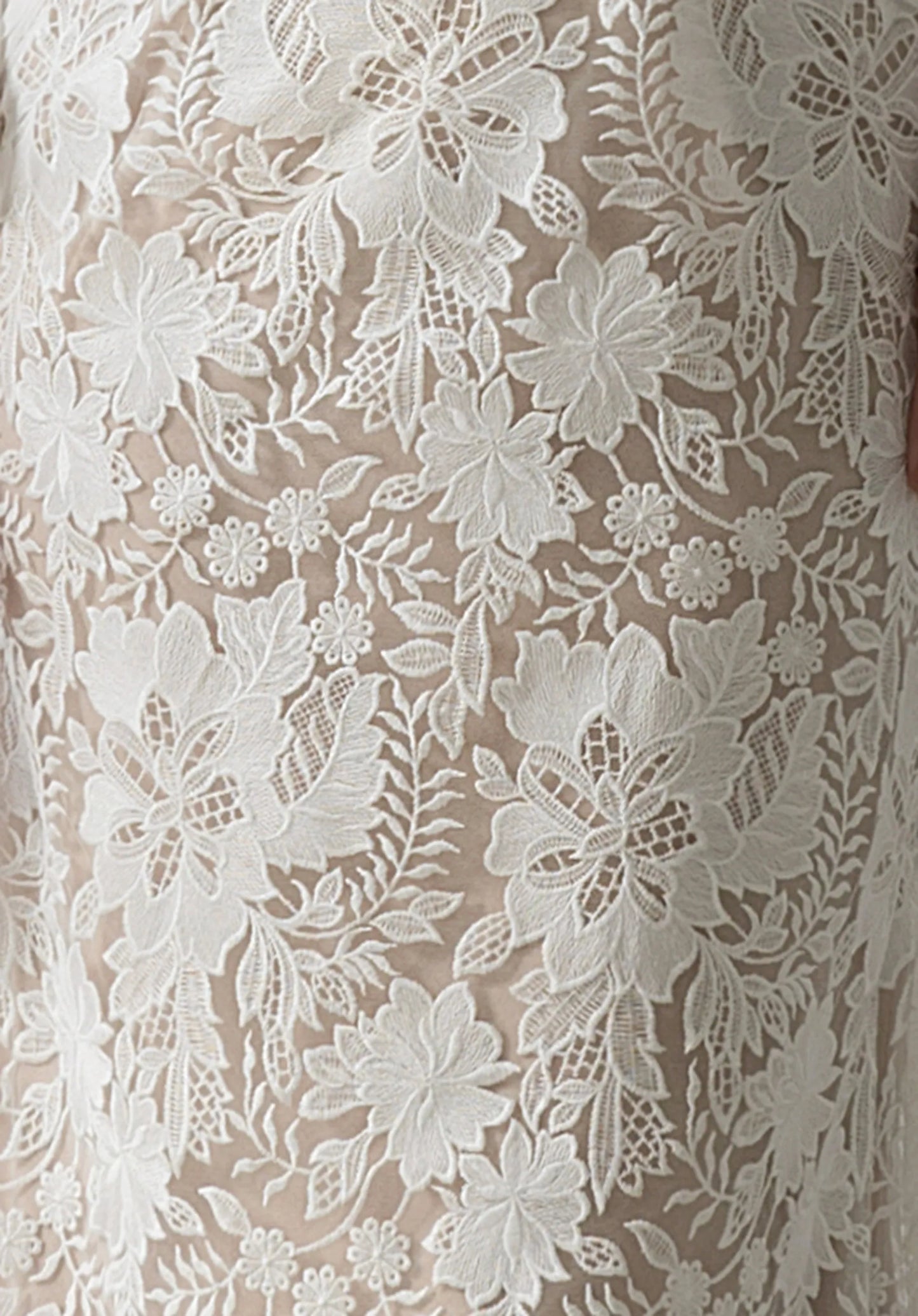 The delicate floral lace features intricate embroidery.