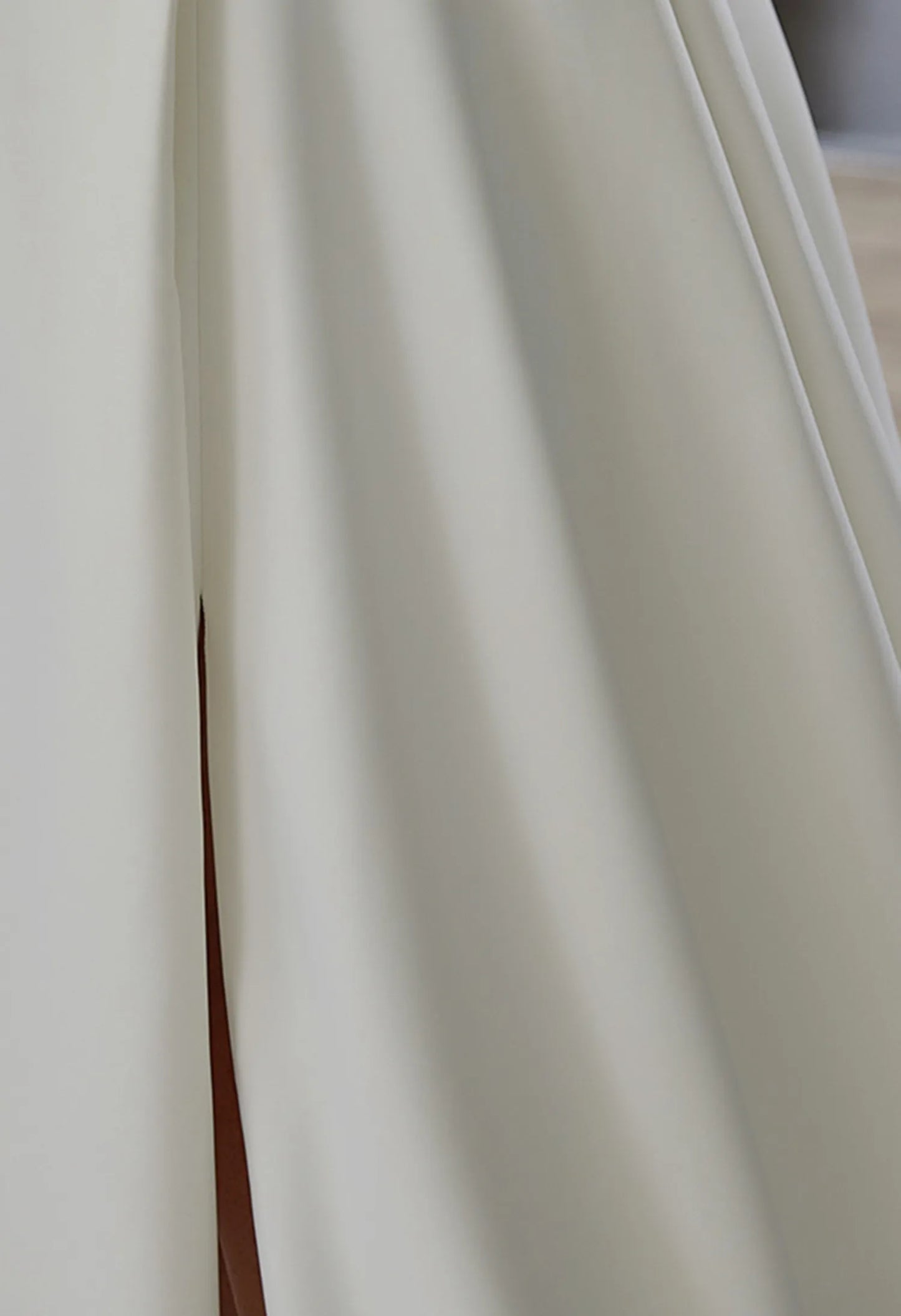 features a side slit, adding a touch of elegance and movement.