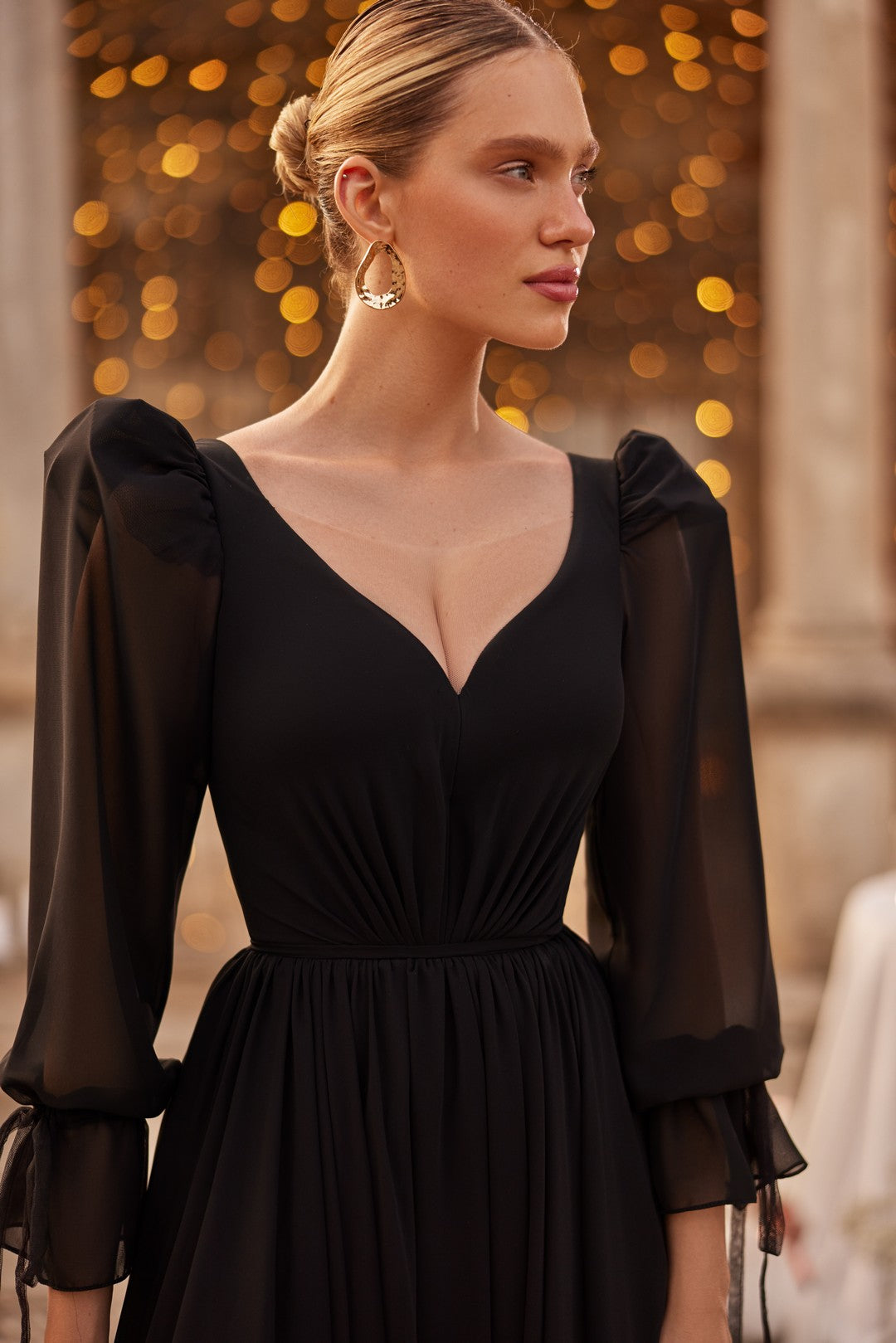 Close up of Bride wearing The Storm Bridal Gown is a daring twist on classic bridal fashion. Designed by Nataliya Vilchuk
