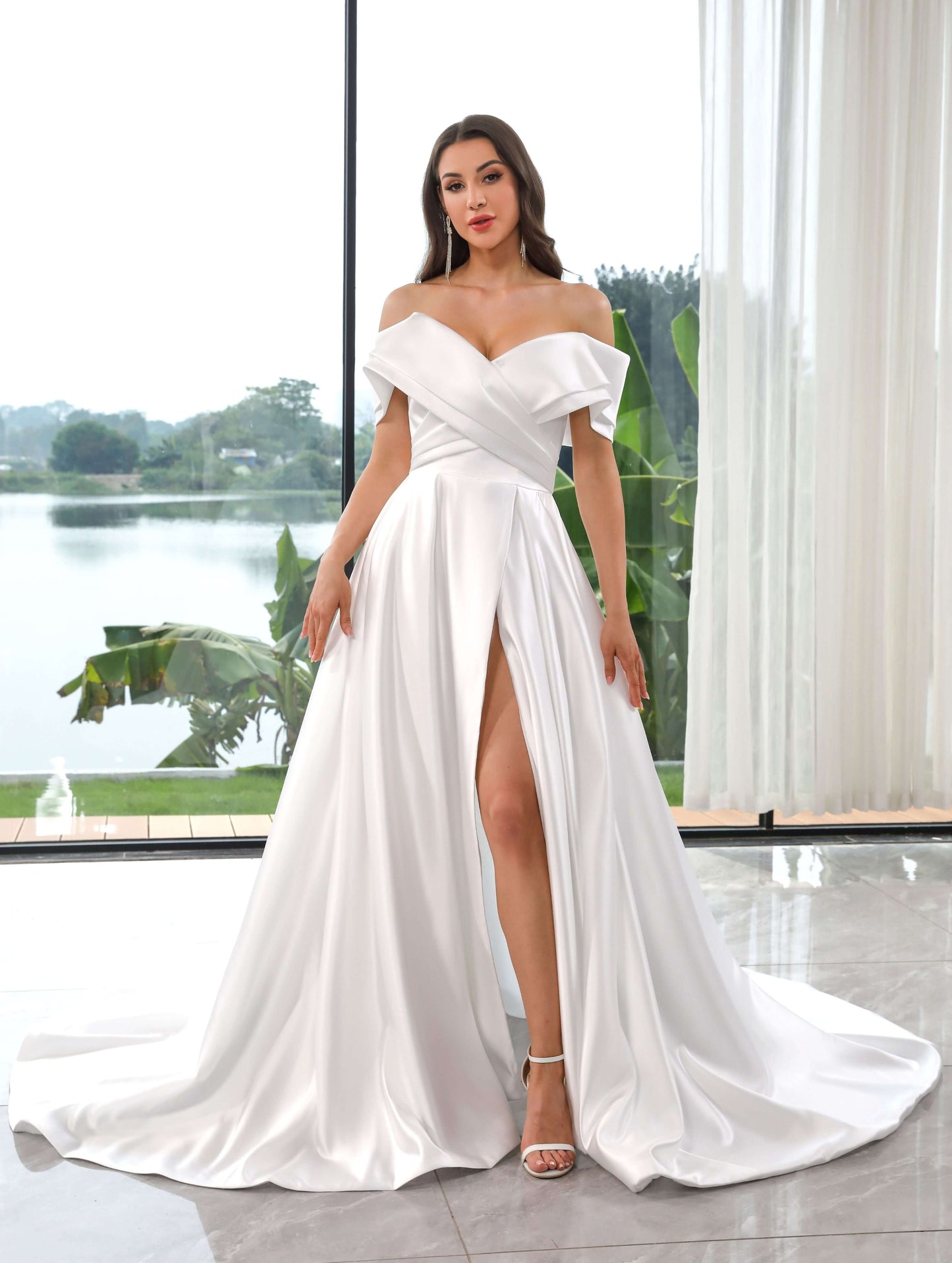 model wearing a Satin Aline Gown featuring a flattering off-the-shoulder bateau neckline