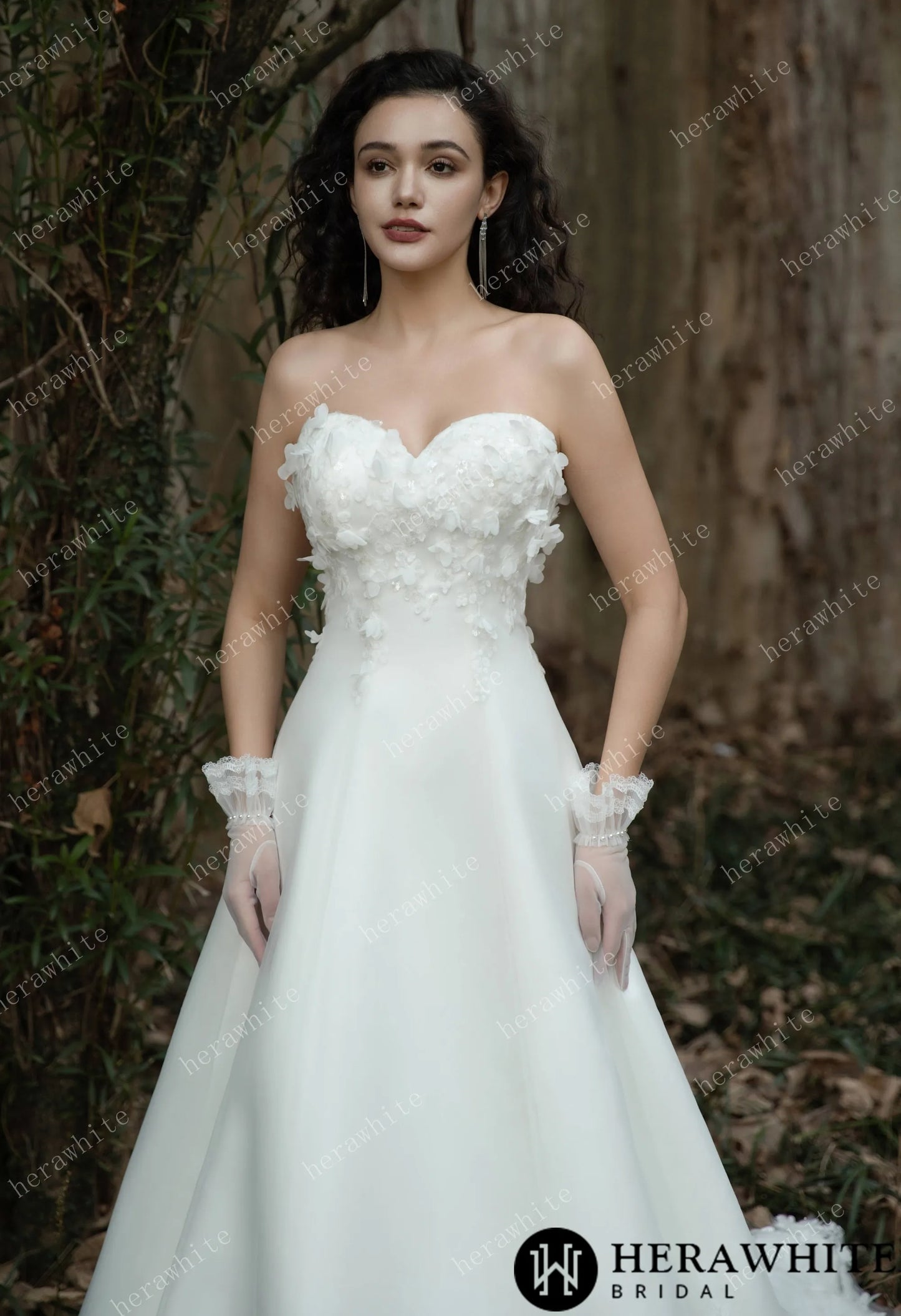 Bride wearing the Faith – Sweetheart Neckline Satin Bridal Gown with sheer gloves