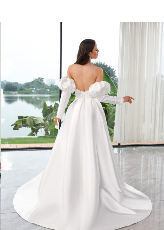 Ella Modern Wedding Gown with petal neckline, dramatic slit, and detachable puff sleeves.