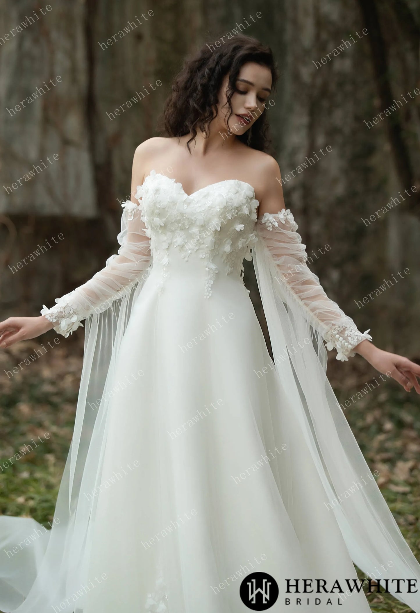 Close-up of a Bride wearing the Faith – Sweetheart Neckline Satin Bridal Gown with detachable sleeves & trailing Ribbons