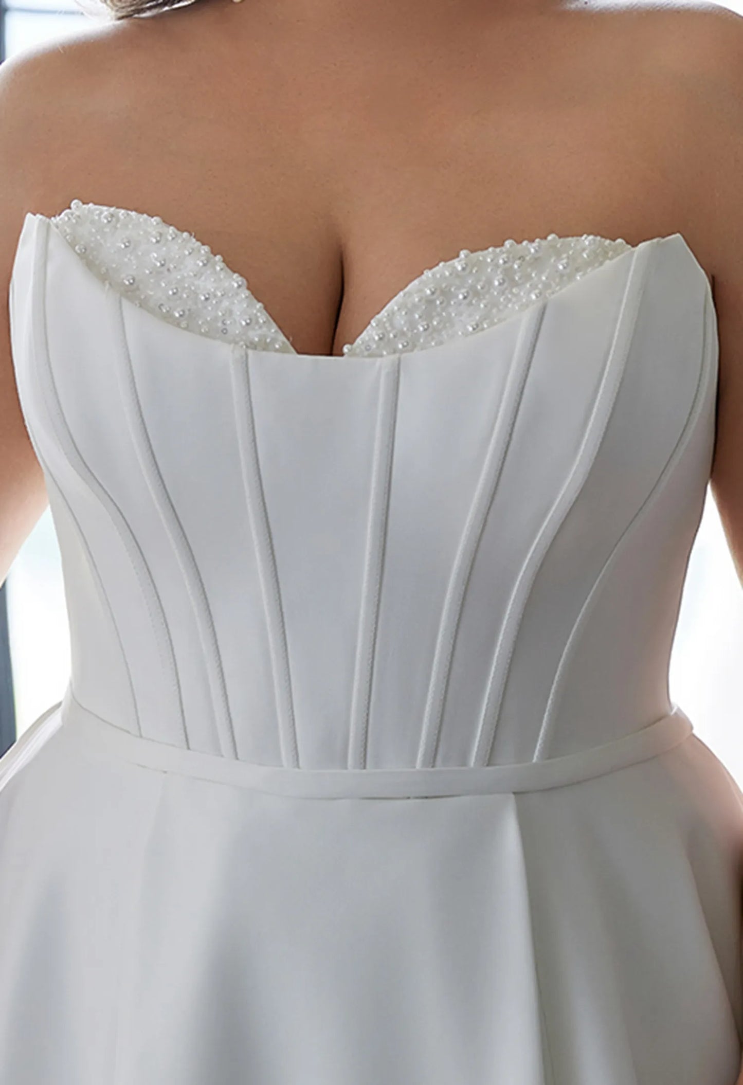 Gown has a sweetheart neckline, beaded, elegant and flattering.