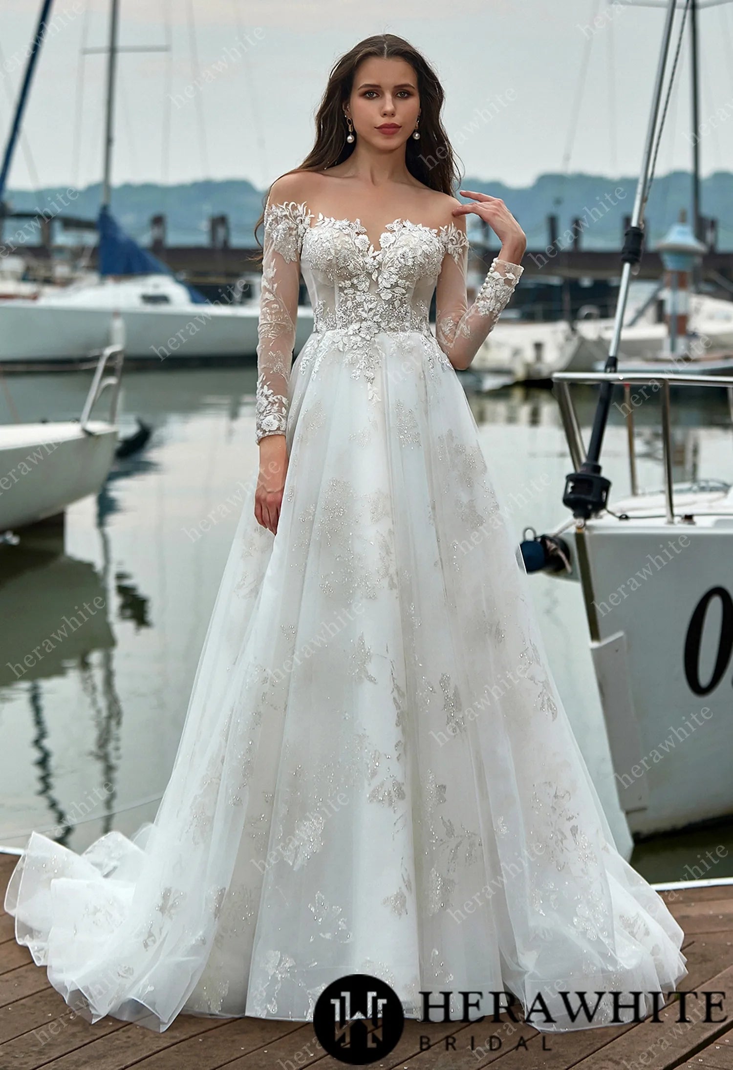 Romantic bridal gown with pearl buttons and shimmer lace