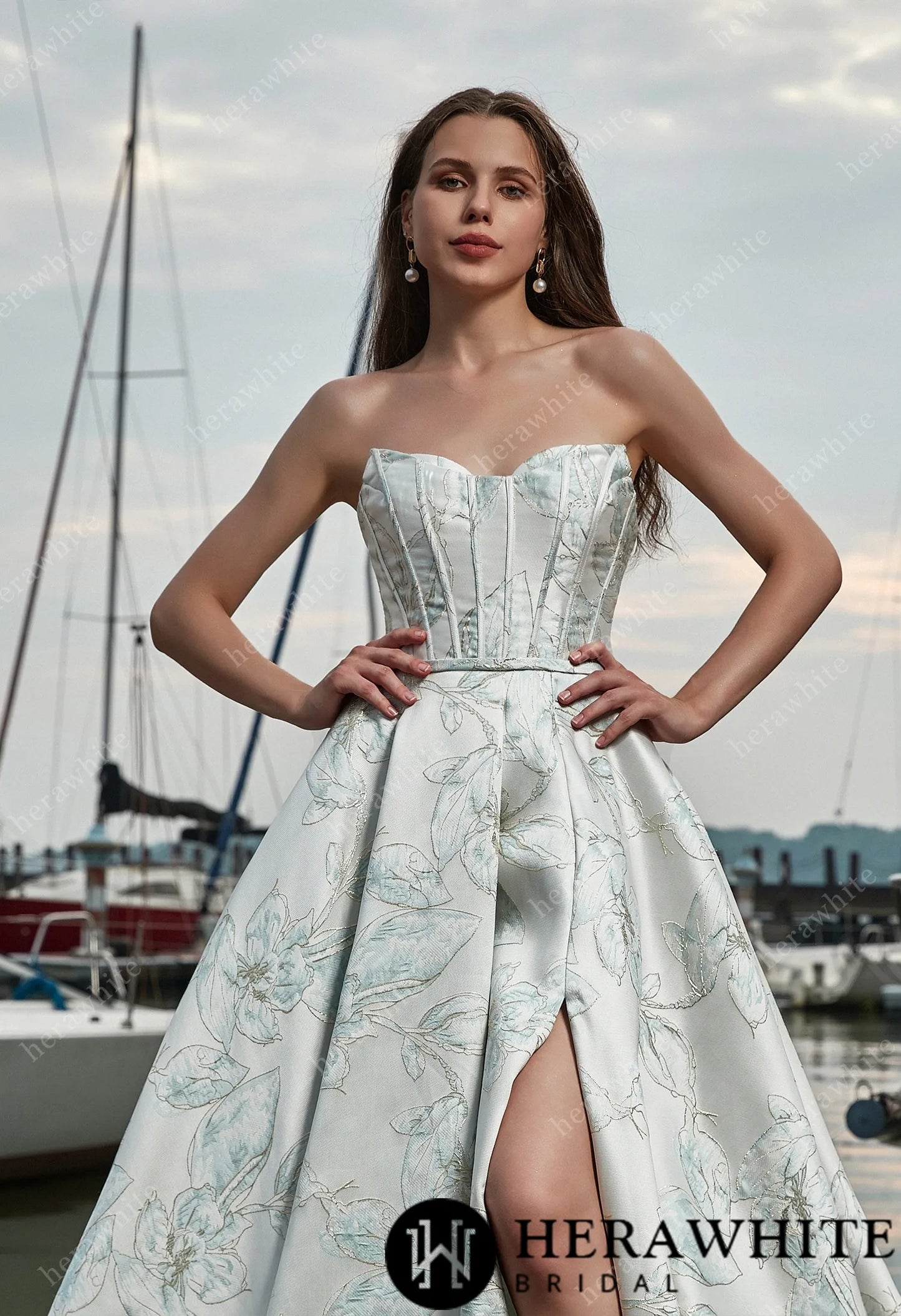 Strapless bridal gown with high slit and pleated skirt