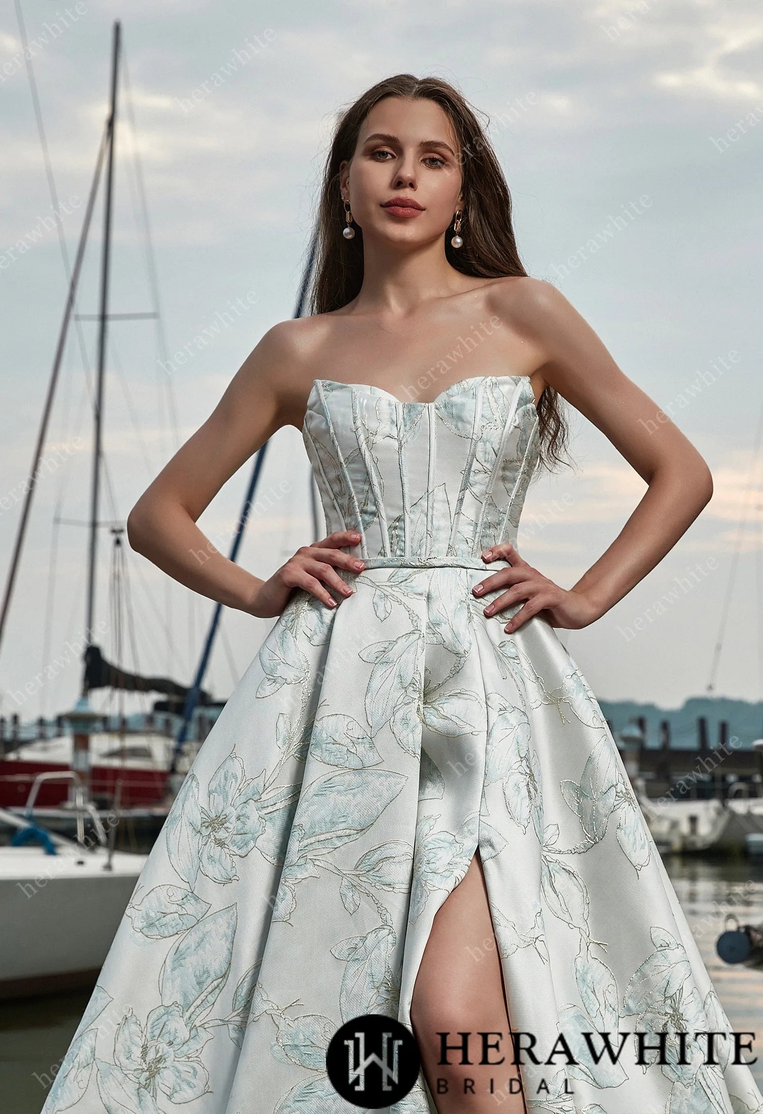 Strapless bridal gown with high slit and pleated skirt