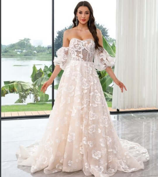 model wearing a Fairy Flower Lace A-line Bridal Gown with detachable sleeves