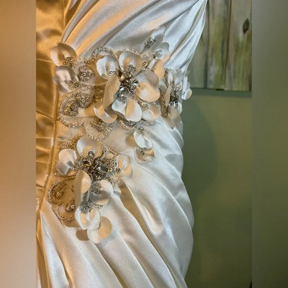 Clearance Sale: Satin A-Line Wedding Gown with flower appliques, sleeveless bodice and ruching.