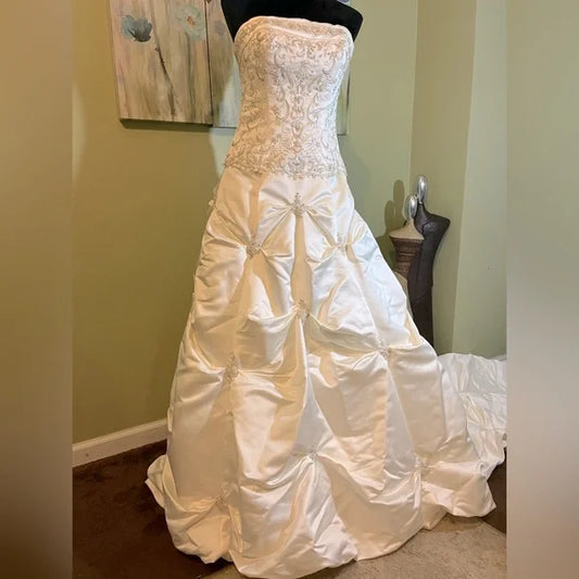 Clearance Sale: Princess Wedding Gown with a Sleeveless Bodice, Rhinestones and Pickup Skirt.