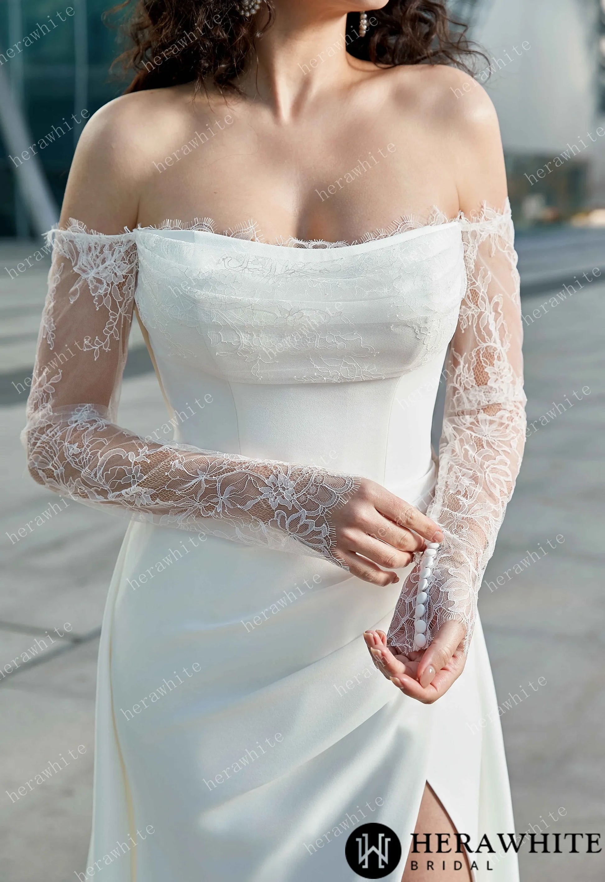 Closeup of Bride wearing the "Megan" Modern Glam-Off-the-Shoulder Bridal Gown with Delicate Lace Sleeves