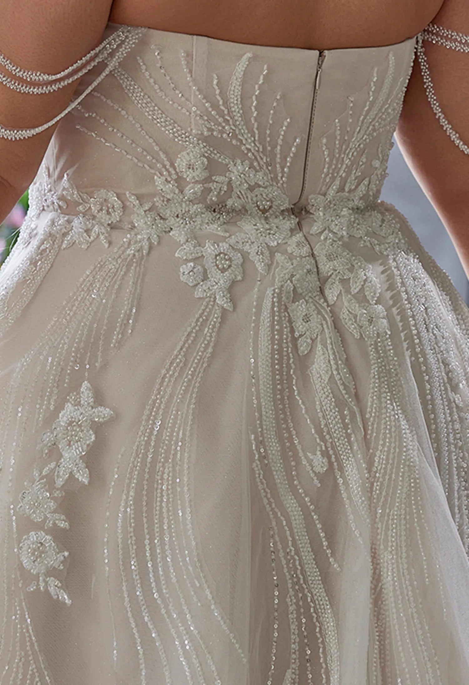 back has beadwork, lace flowers, and a zipper, elegant and detaile
