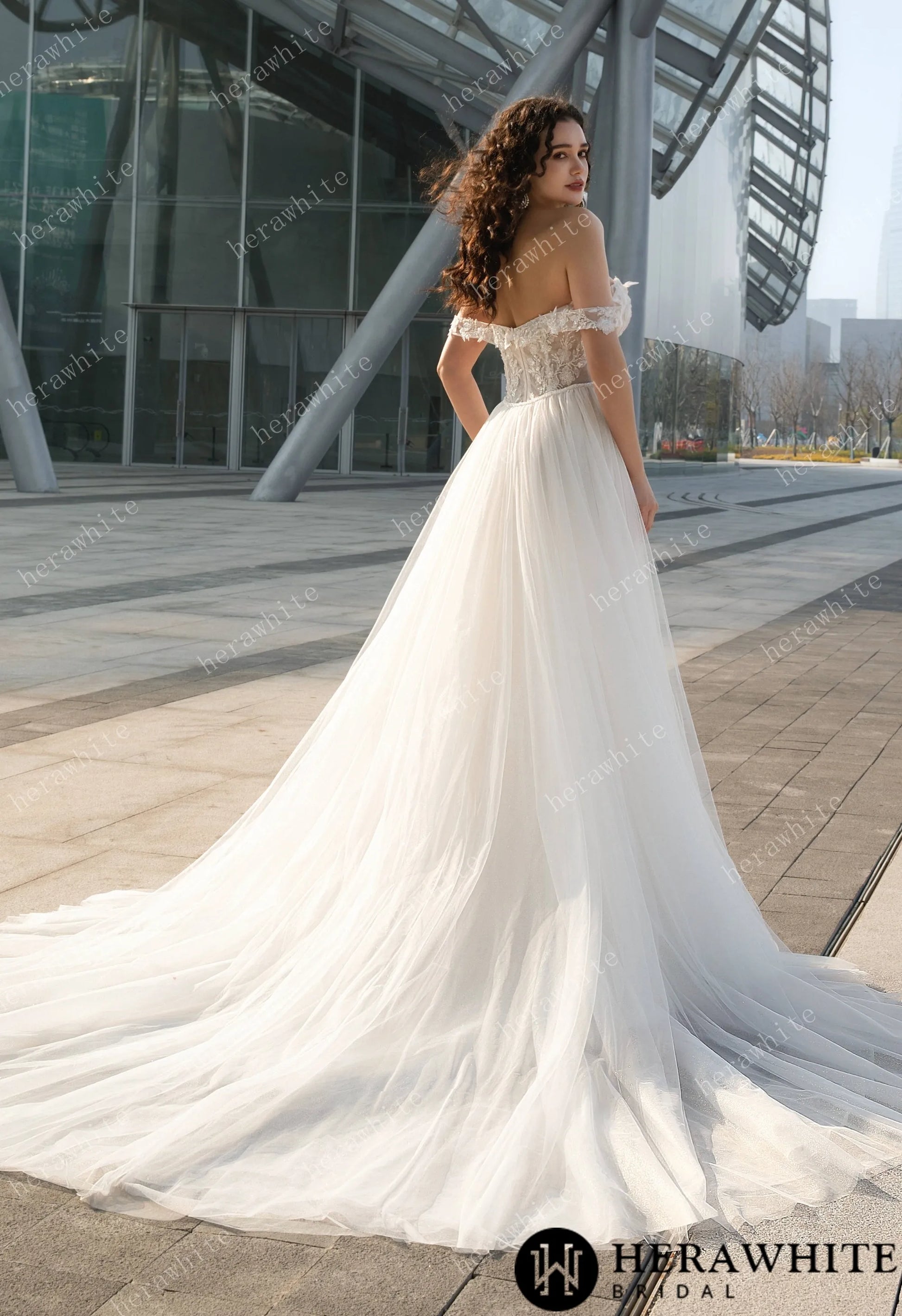 Backview of ride wearing the Jasmine Fit-and-Flare Wedding Gown | Off-the-Shoulder Lace & Tulle Train