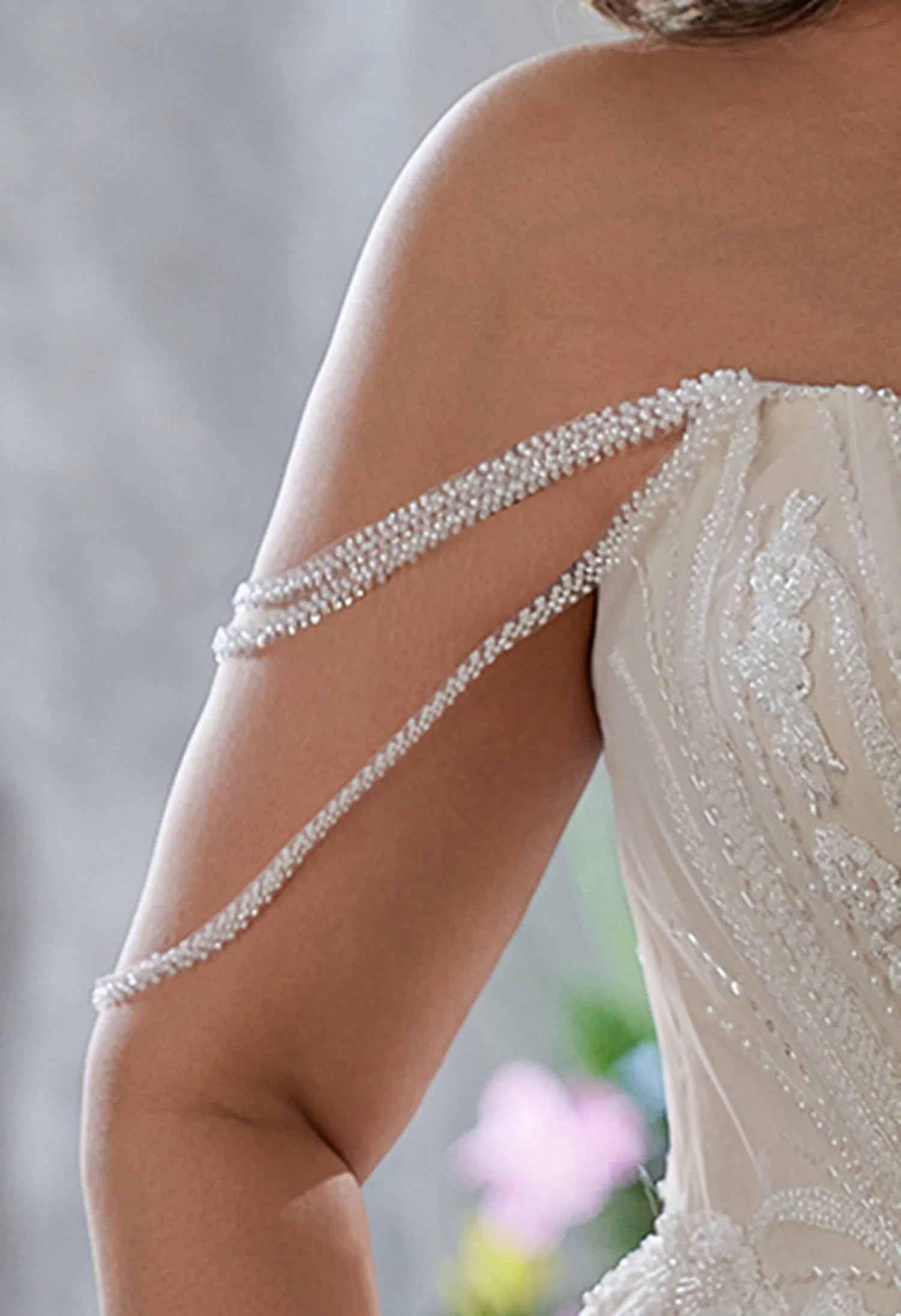 Gown has beaded, off - shoulder, draped sleeve straps, delicate and chic.