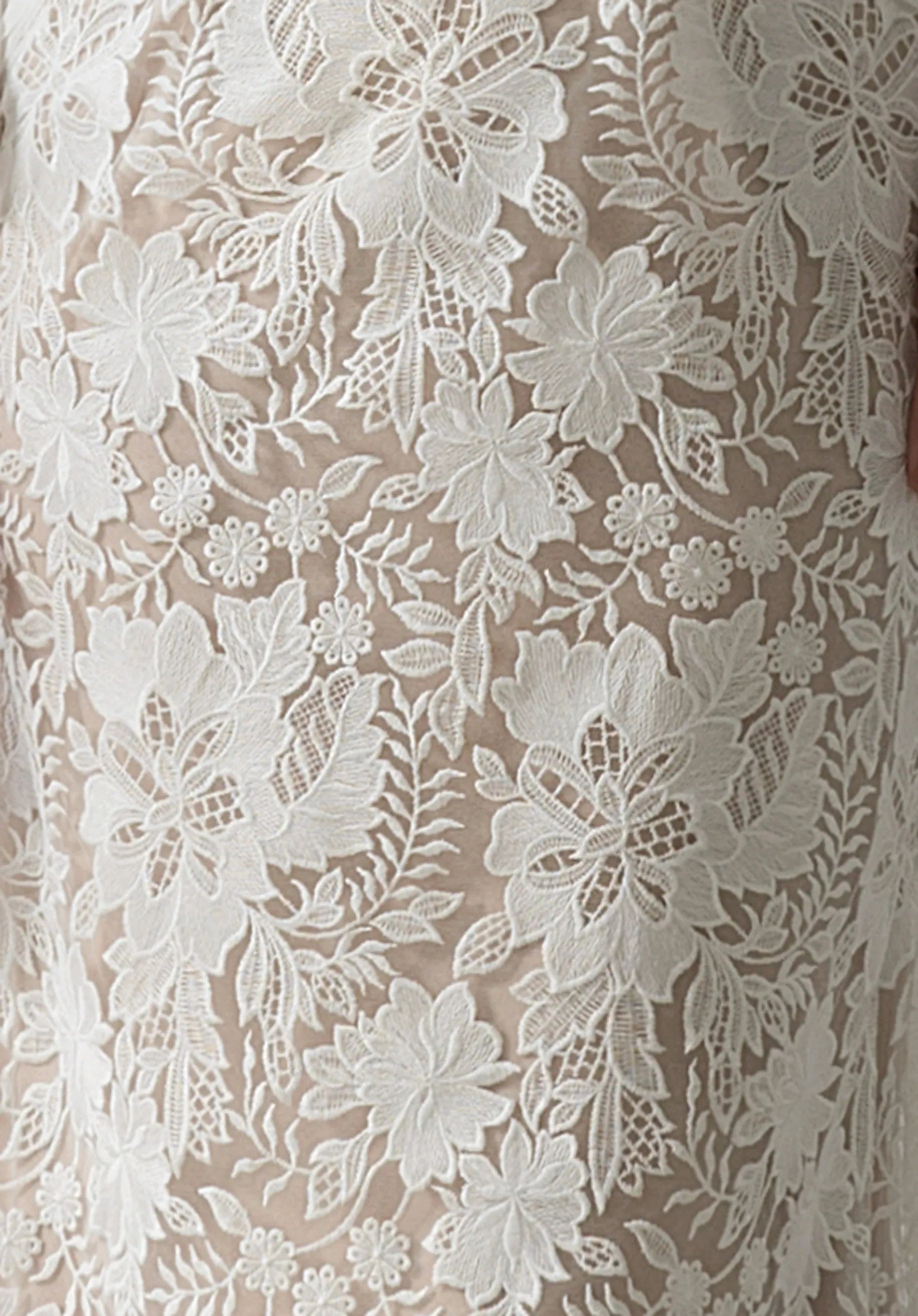 The delicate floral lace features intricate embroidery.