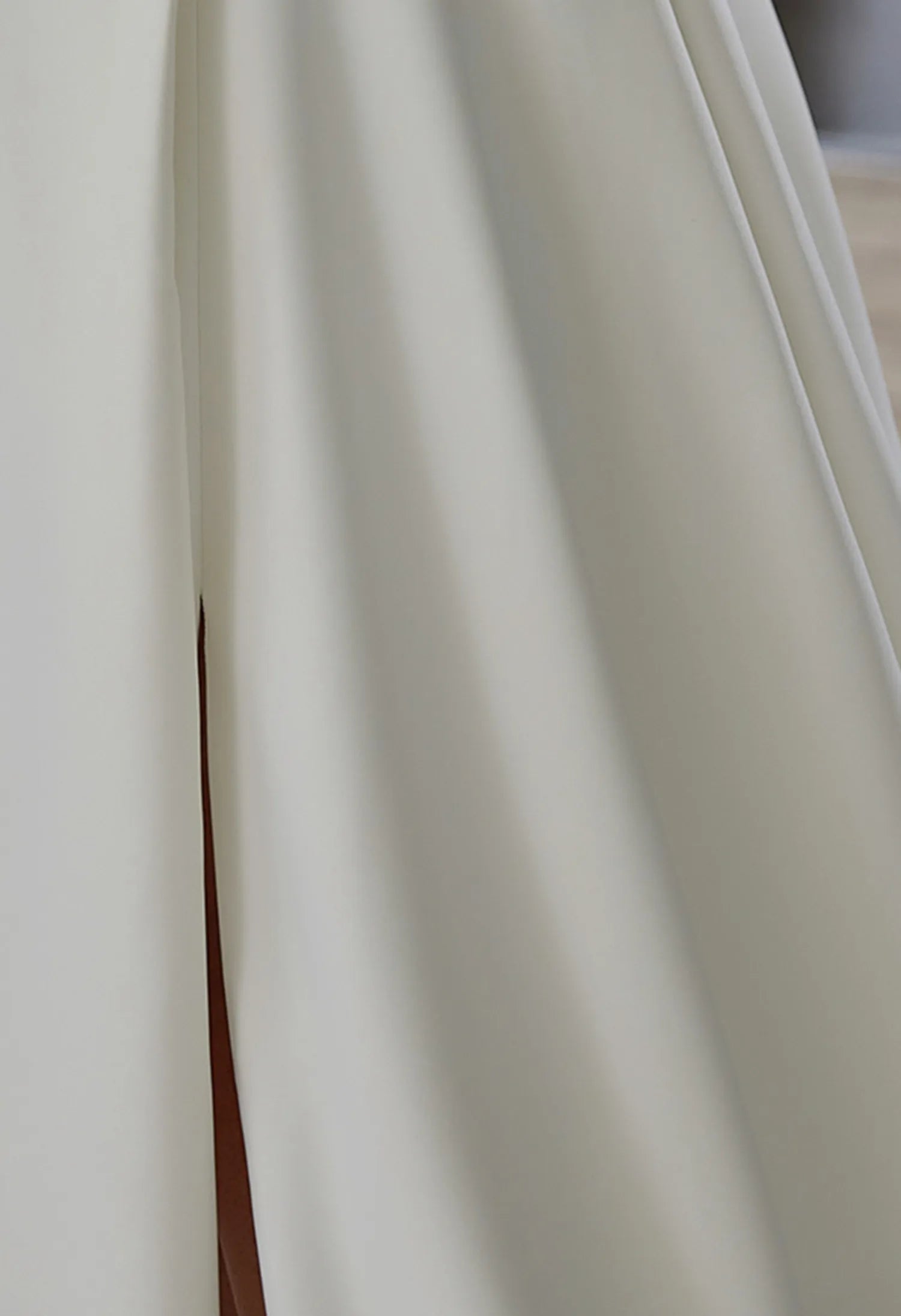 features a side slit, adding a touch of elegance and movement.