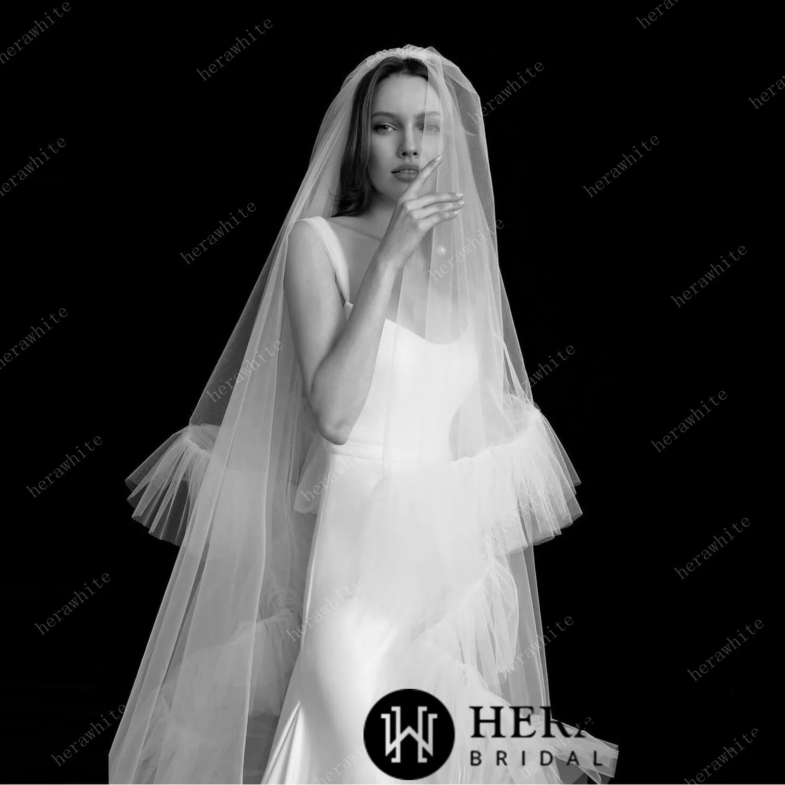 Model wearing the Perfect Pair Collection . Matching gown and veil by Herawhite Bridal