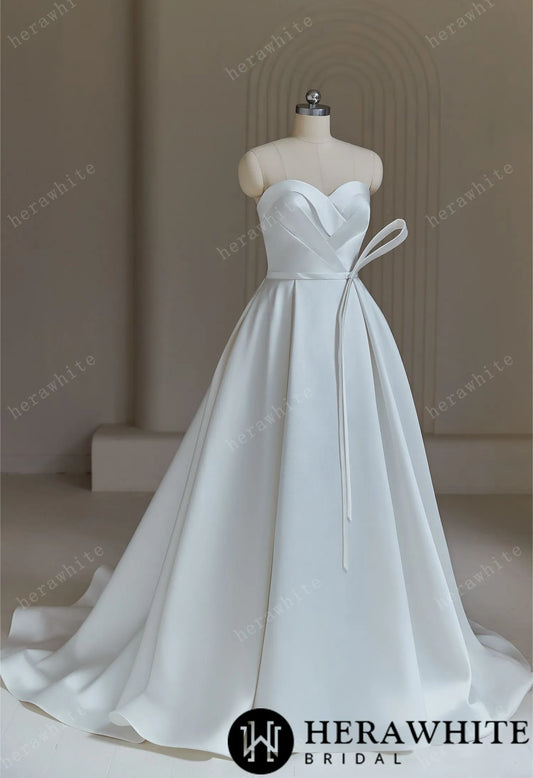 Ball Gown Wedding Dress With Pleated Bodice And Detachable Bow