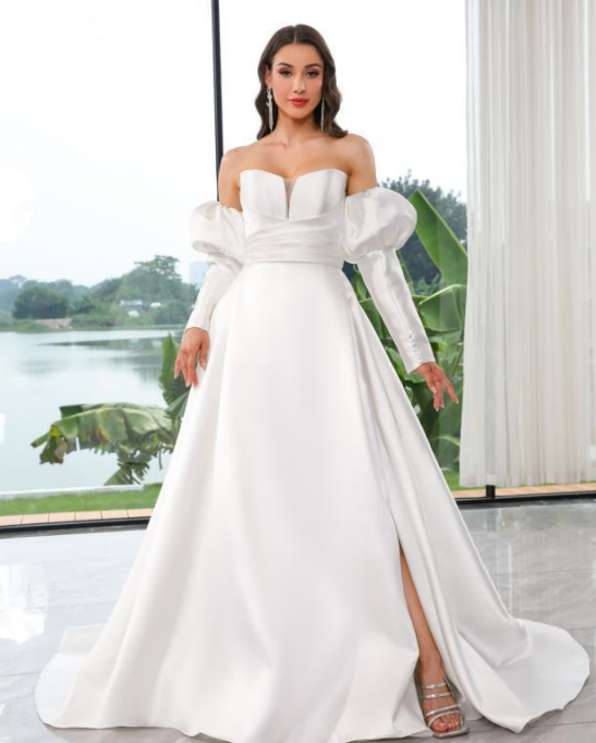 Ella Modern Wedding Gown with petal neckline, dramatic slit, and detachable puff sleeves.
