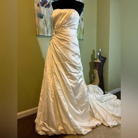 Clearance Sale: Satin A-Line Wedding Gown with flower appliques, sleeveless bodice and ruching.